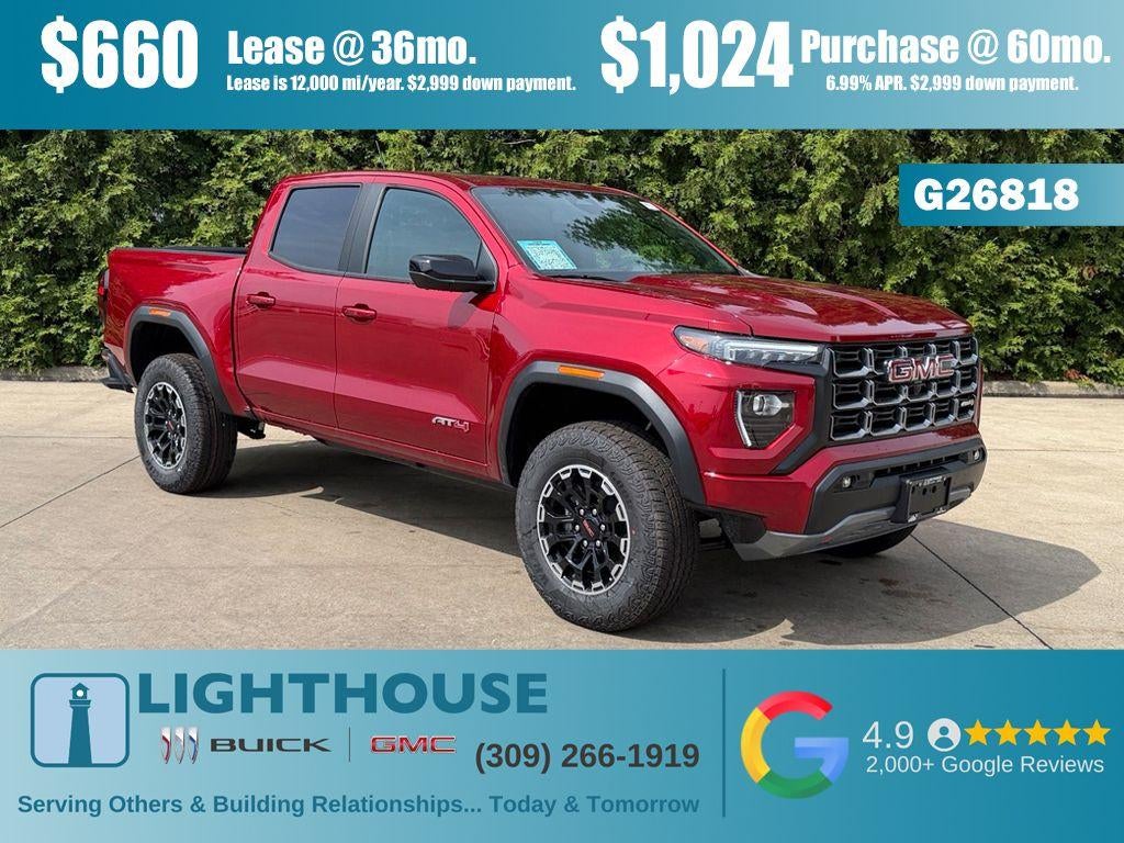2026 GMC Canyon 4WD AT4 in Volcanic Red Tintcoat — front three-quarter view