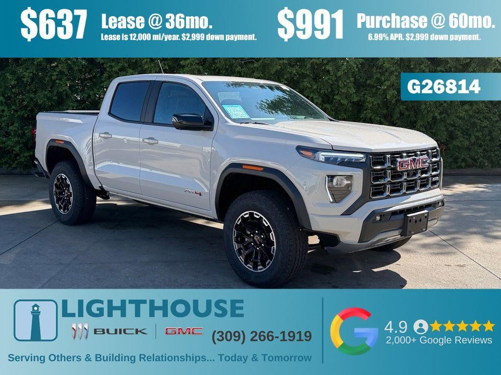 2026 GMC Canyon 4WD AT4 in Coastal Dune — front three-quarter view
