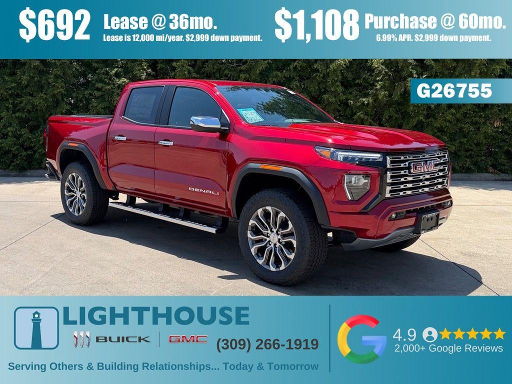 2026 GMC Canyon 4WD Denali in Volcanic Red Tintcoat — front three-quarter view
