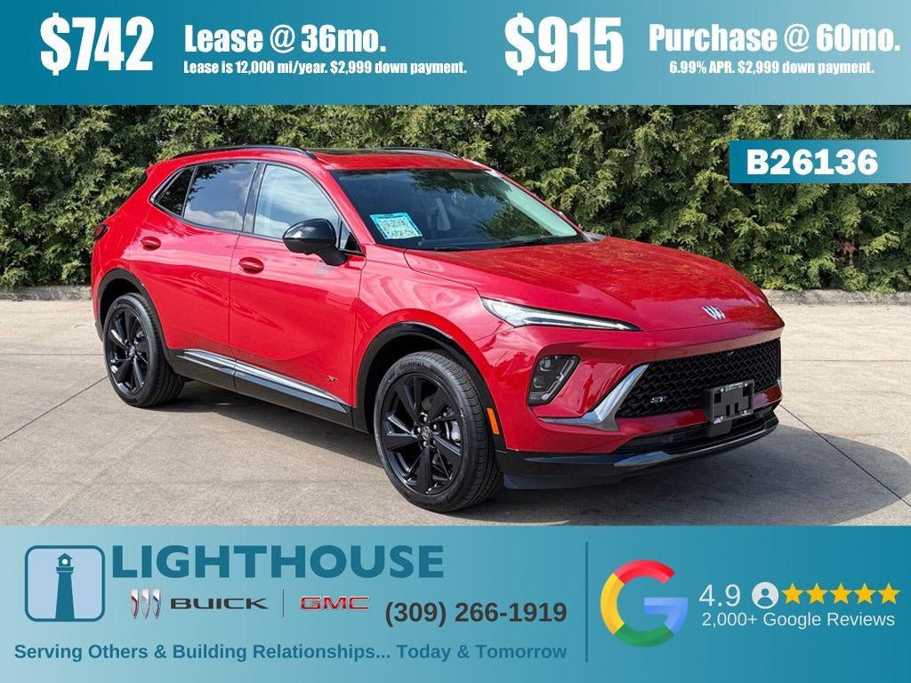 2026 Buick Envision Sport Touring in Brilliant Red — front three-quarter view
